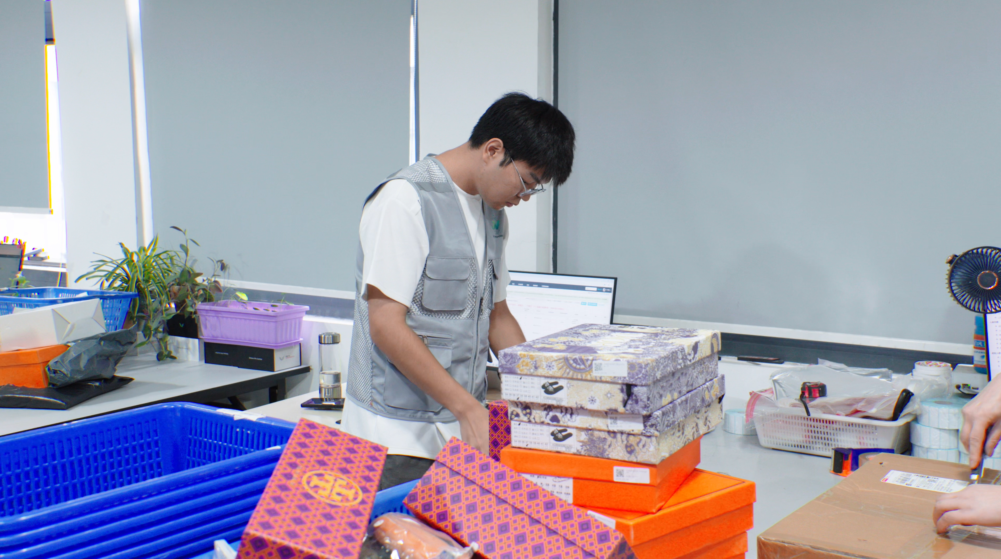 Quantity count: JW team recording product inspection results